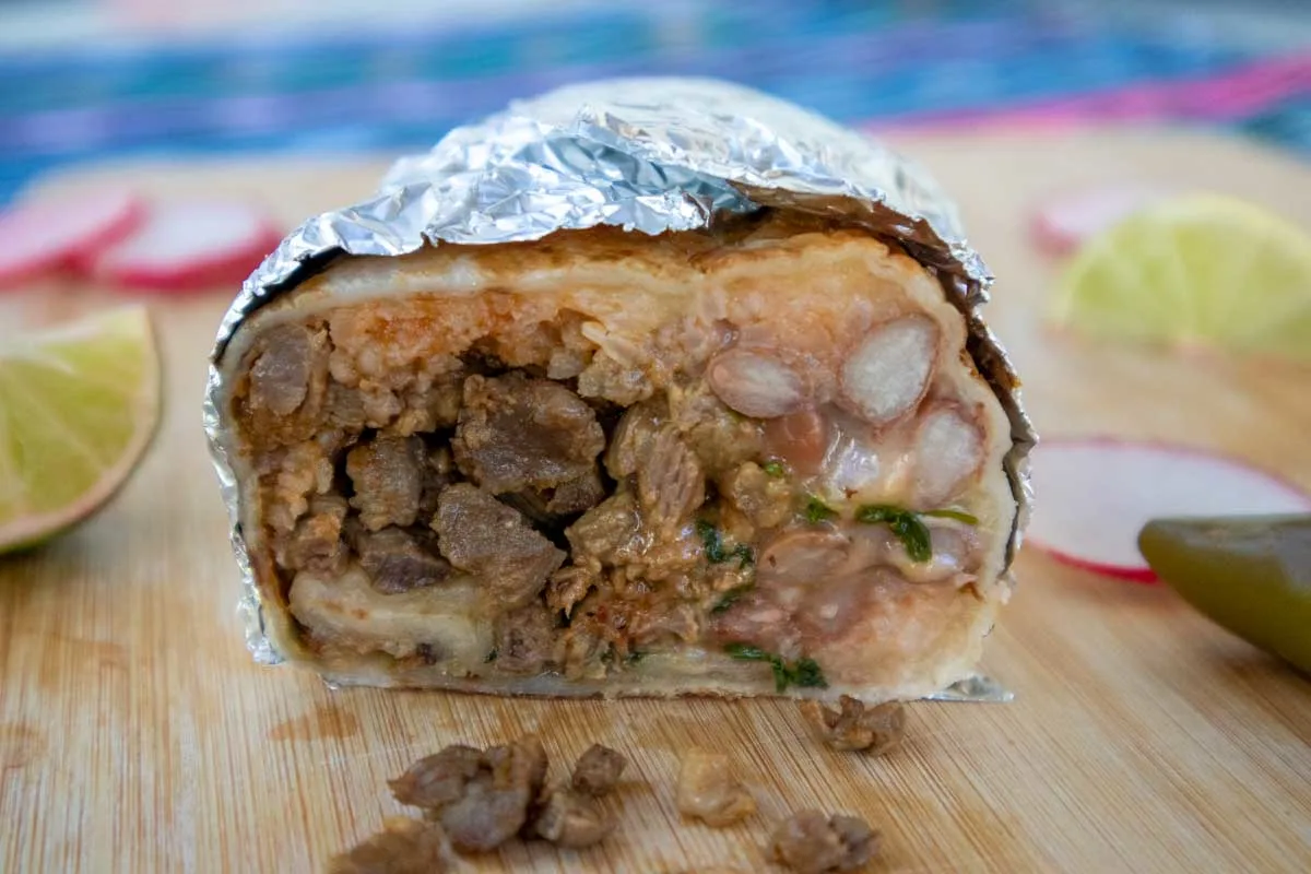Burrito cut in half wrapped in foil eaten in San Miguel de Allende Mexico