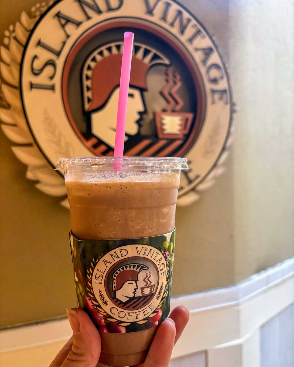 A person holds coffee at Islaand Vintage Coffee in Waikiki Honolulu Hawaii (71)