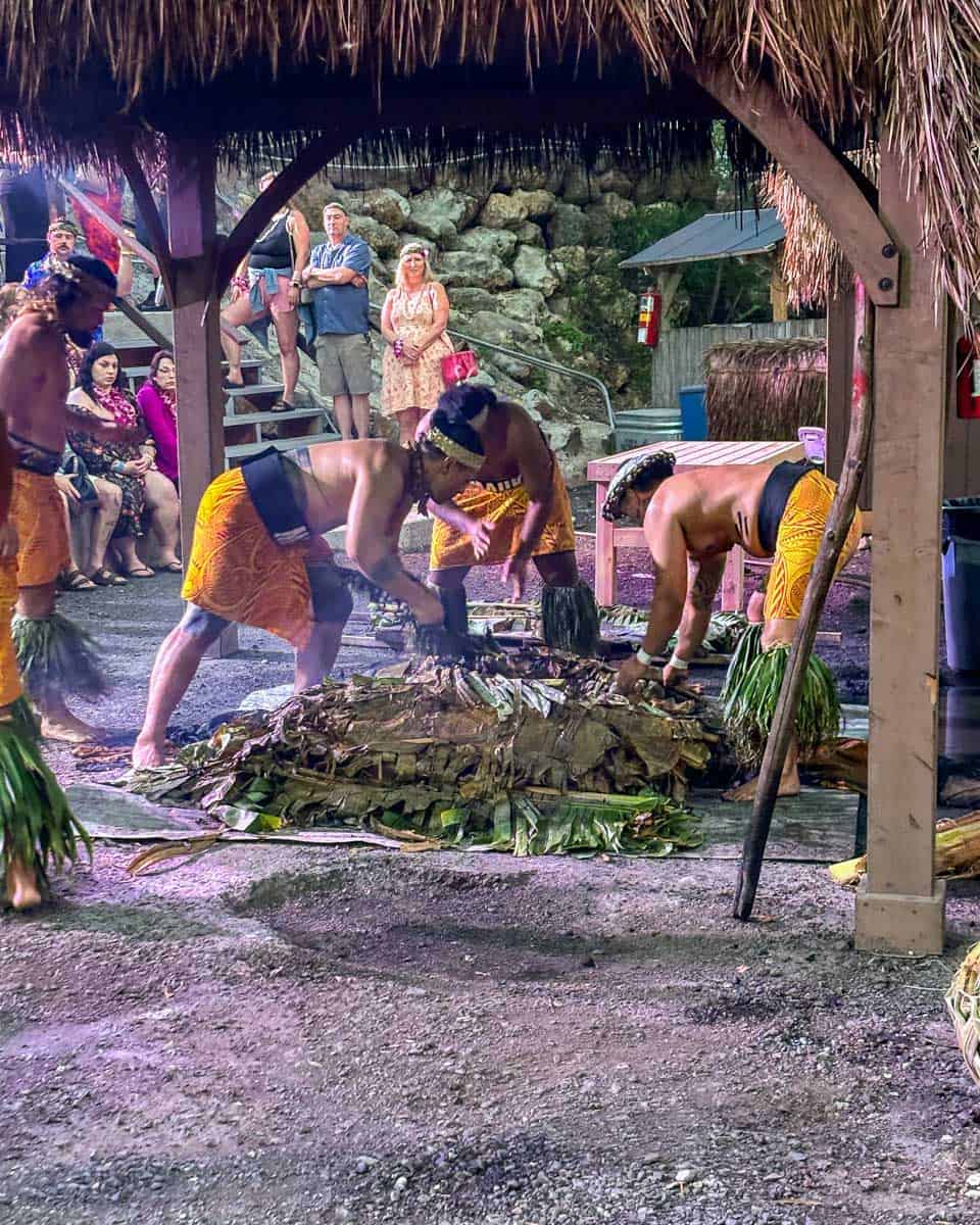 Men-prepare-food-at-a-Luau-on Oahu-Hawaii-16