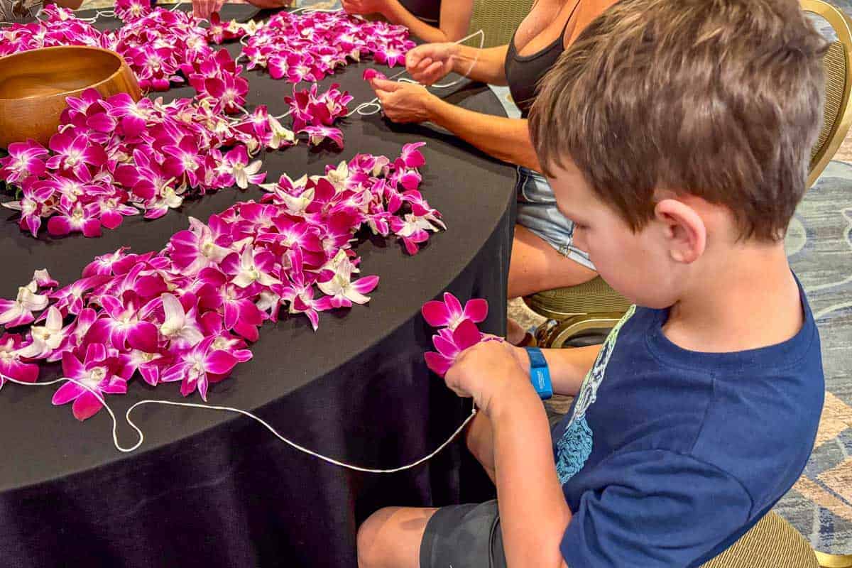 Trelle-son-in-Hawaii-making-a-flower-lei