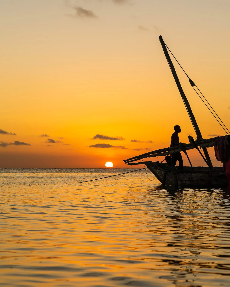 A-dhow-boat-at-sunset-on-a-cruise-from-Zanzibar-Tanzania