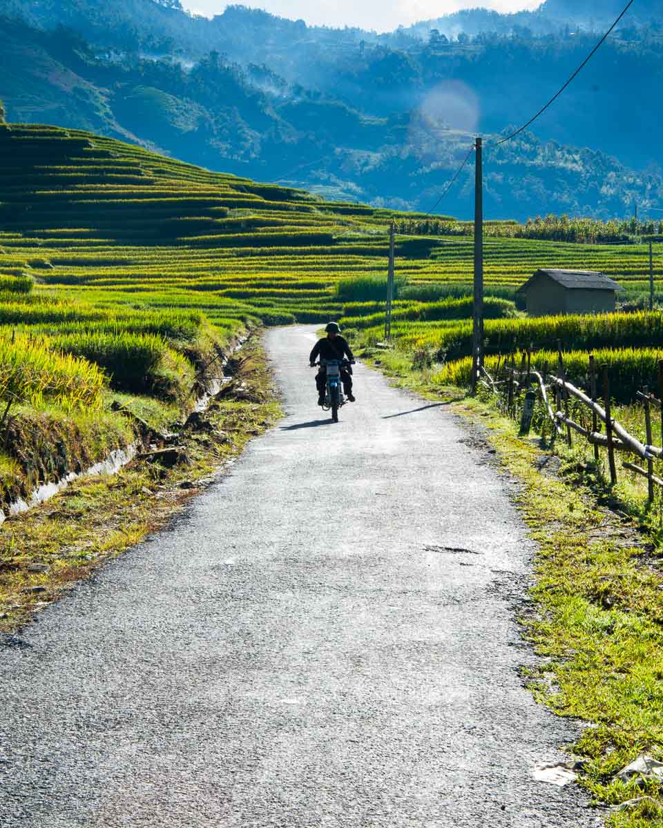 A person rides a motorcycle in O Quy Ho Pass near Sapa Vietnam