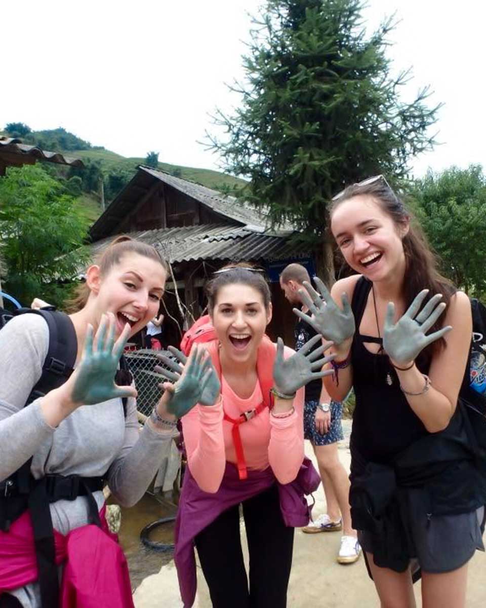 Brittni and friends show off their indigo dyed hands at a Hmong Village in Sapa, Vietnam