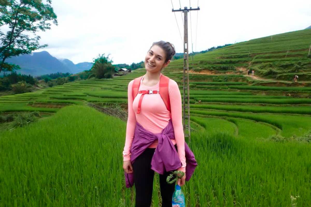 Brittni poses for a photo while hiking through the rice terraces in Sapa, Vietnam