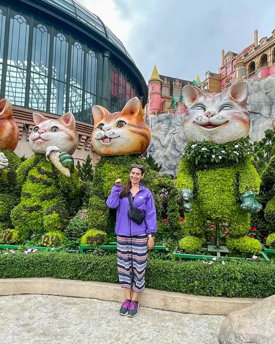 Brittni posing in front of cats statues at Ba Na Hills Vietnam