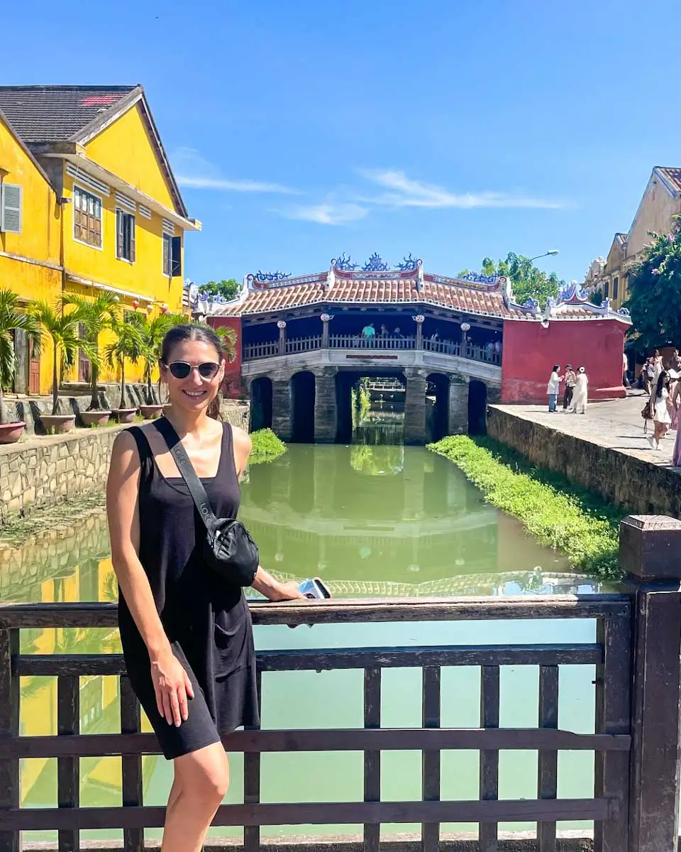 Brittni takes a photo at the Japanese Bridge in Hoi An, Vietnam