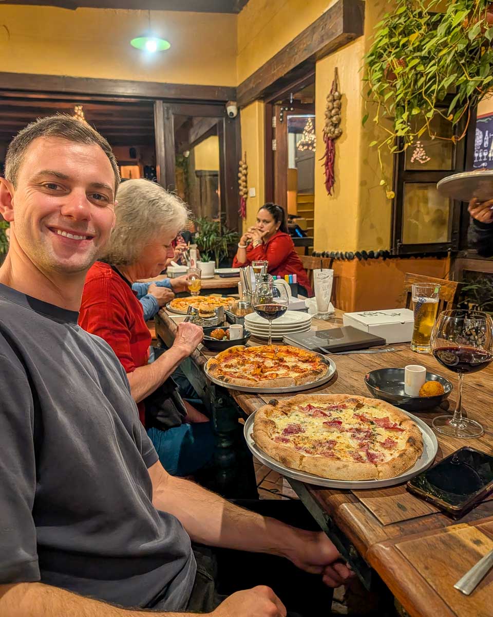 Daniel eats pizza at Roadhouse Cafe in Kathmandu Nepal (2)