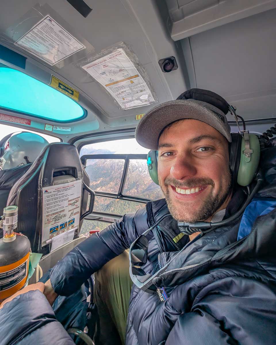 Daniel in a helicopter on the way to Everest Base Camp from Kathmandu Nepal
