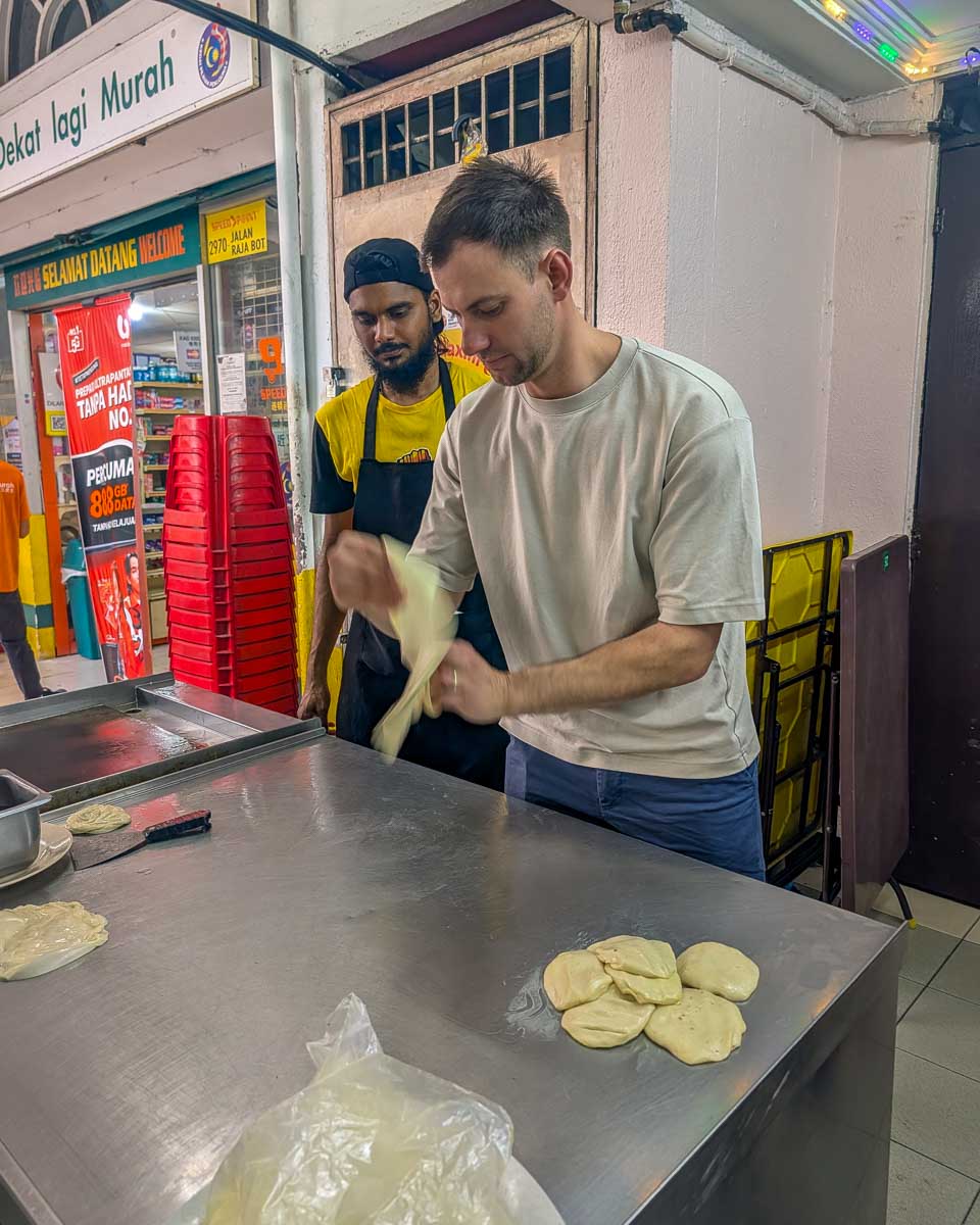 Daniel makes roti on a food tour in Kuala Lumpur Malaysia (2)