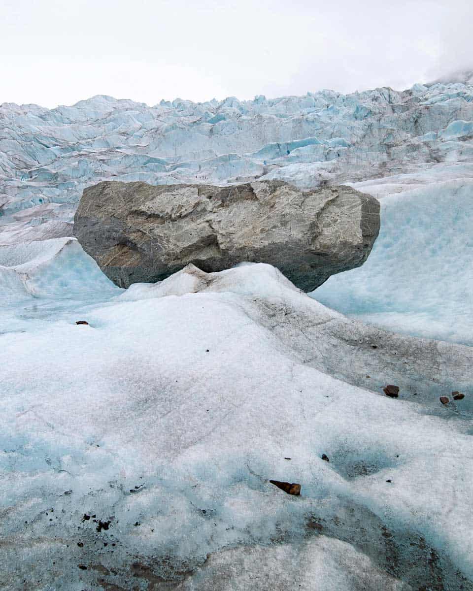 Majestic Mendenhall Glacier with boulder in Alaska