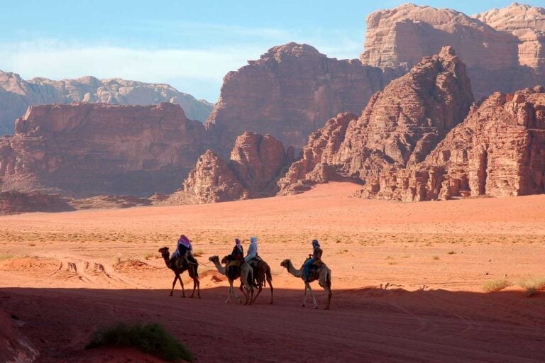 People on camels in Wadi Rum
