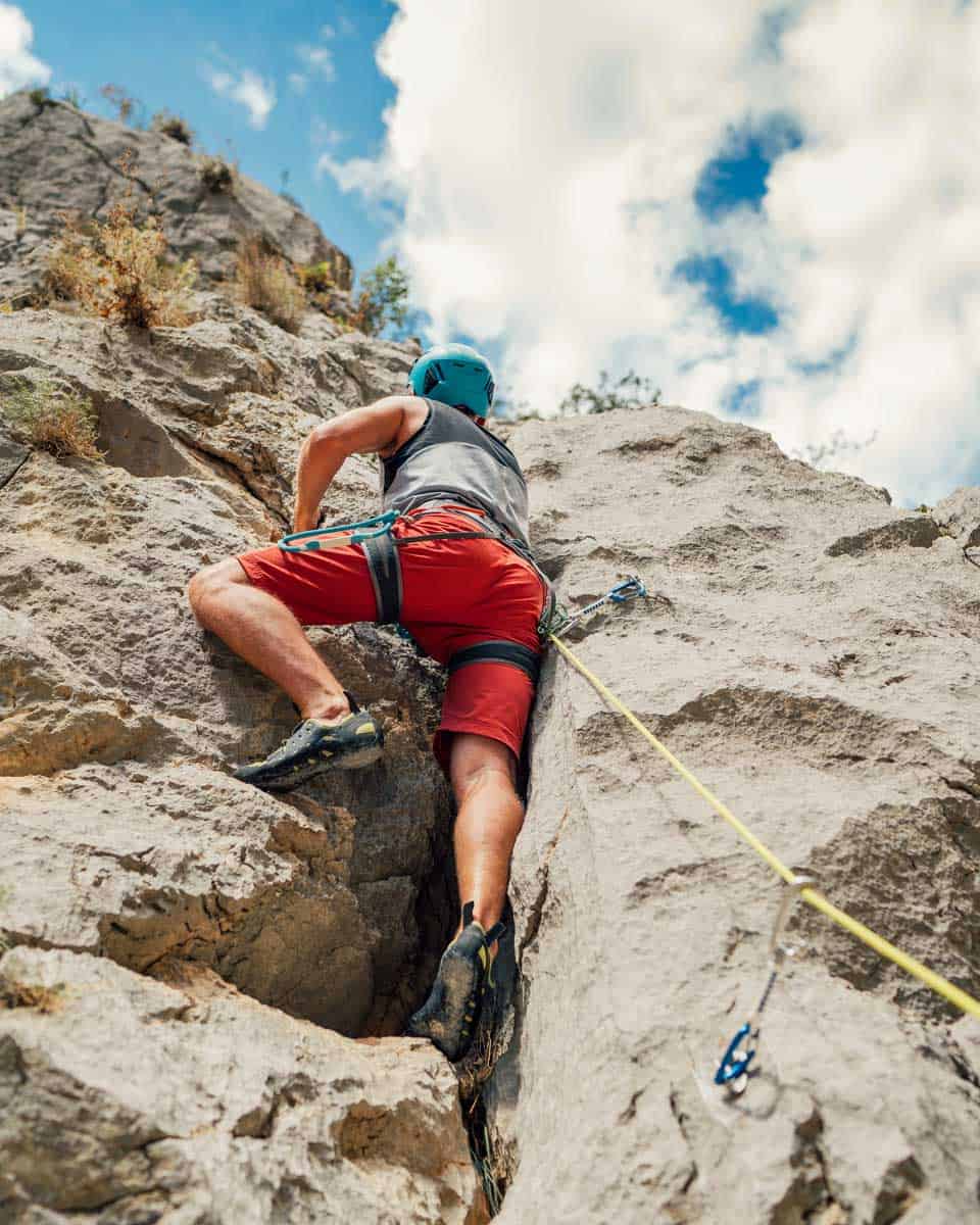 A man climbs and is canyoneering near Moab Utah 1