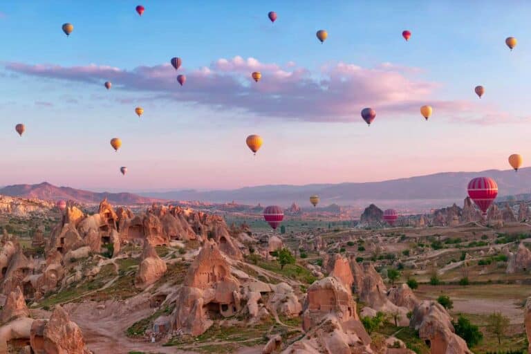 Cappadocia at sunrise and hot air balloons in Turkey