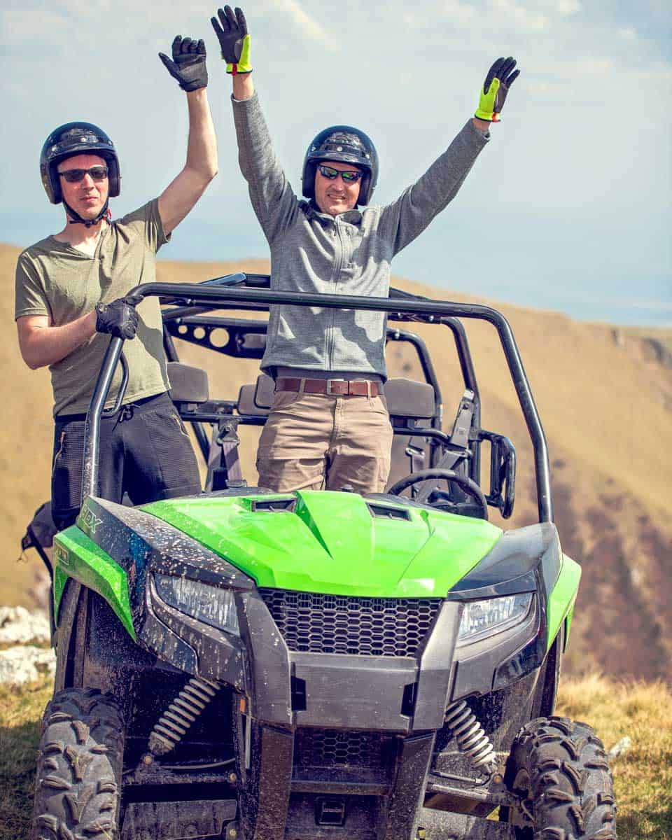 Two people in a UTV at Arches National Park near Moab Utah