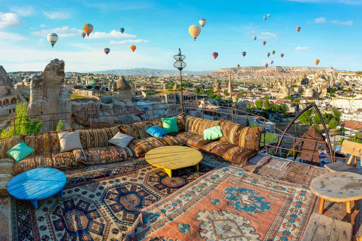 View of hot air balloons from a cafe in Cappadocia Turkey