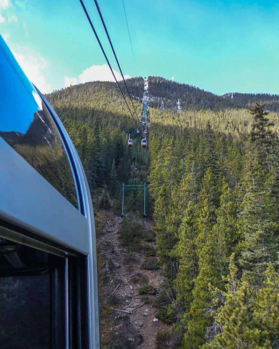 View-out-the-window-as-the Banff gondola-car-travels-up-Sulphur-Mountain