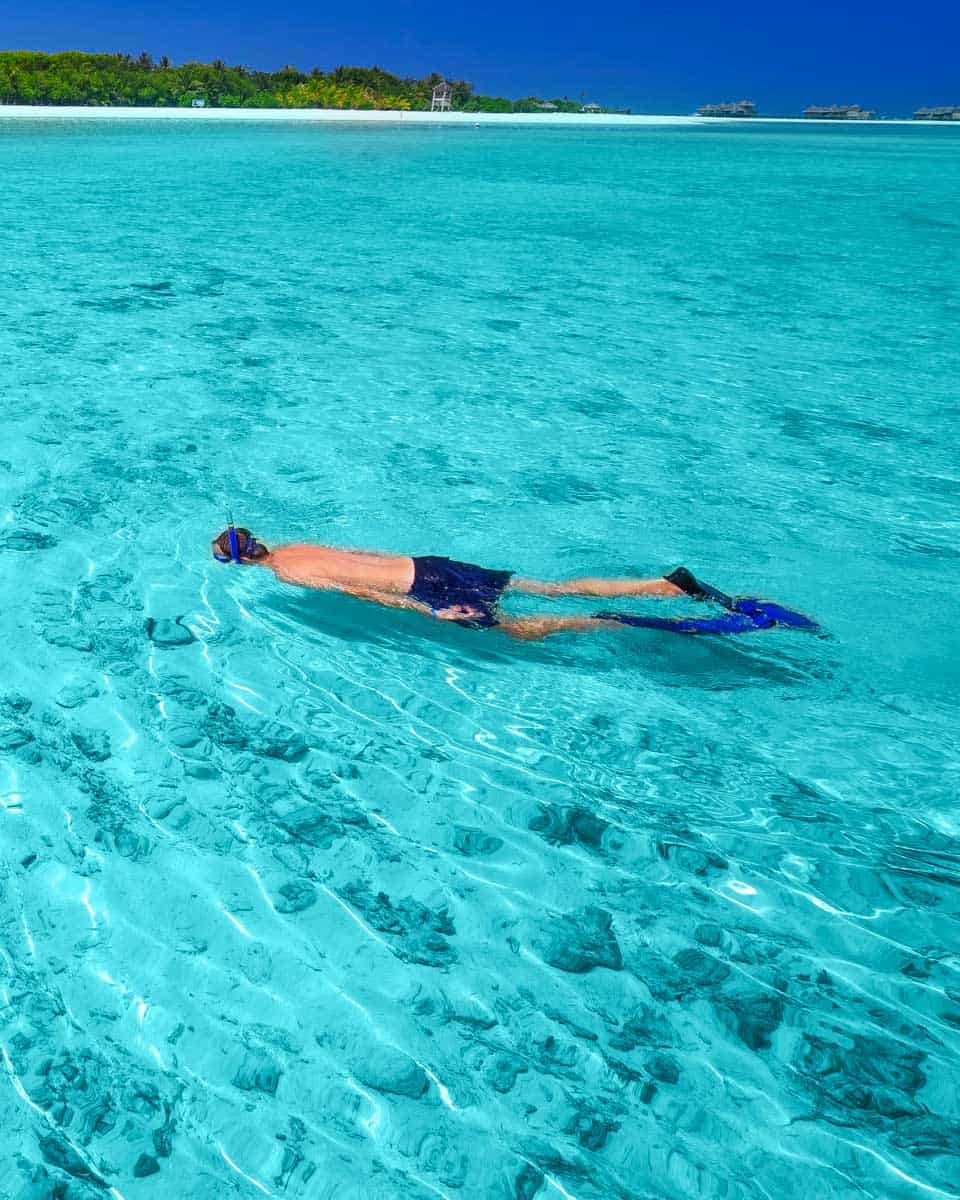 A man snorkels at Ta'ahiamanu Beach in Moorea