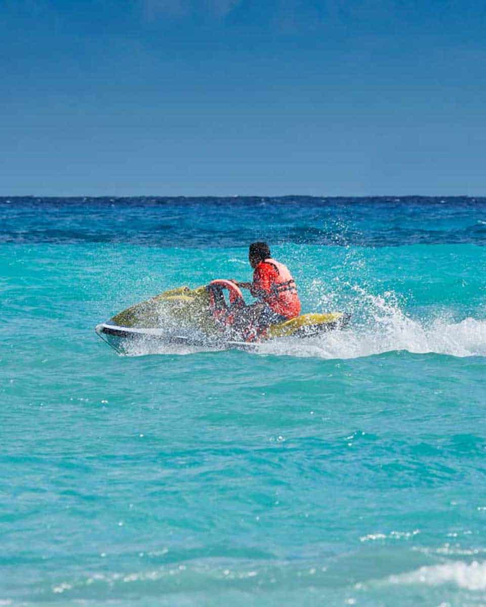 A-person-rides-a-jet-ski-near-Moorea