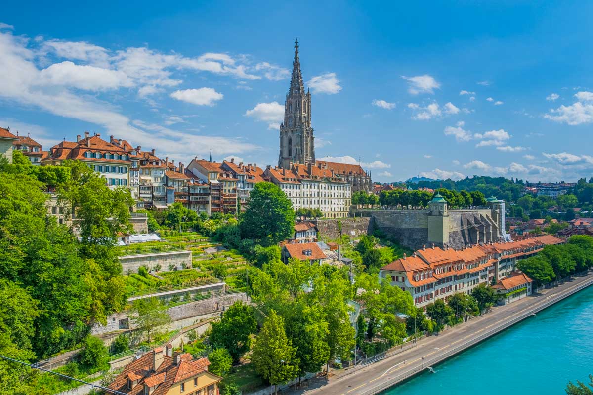 Aare river and Bern Minster, cathedral in the old city of Bern Switzerland