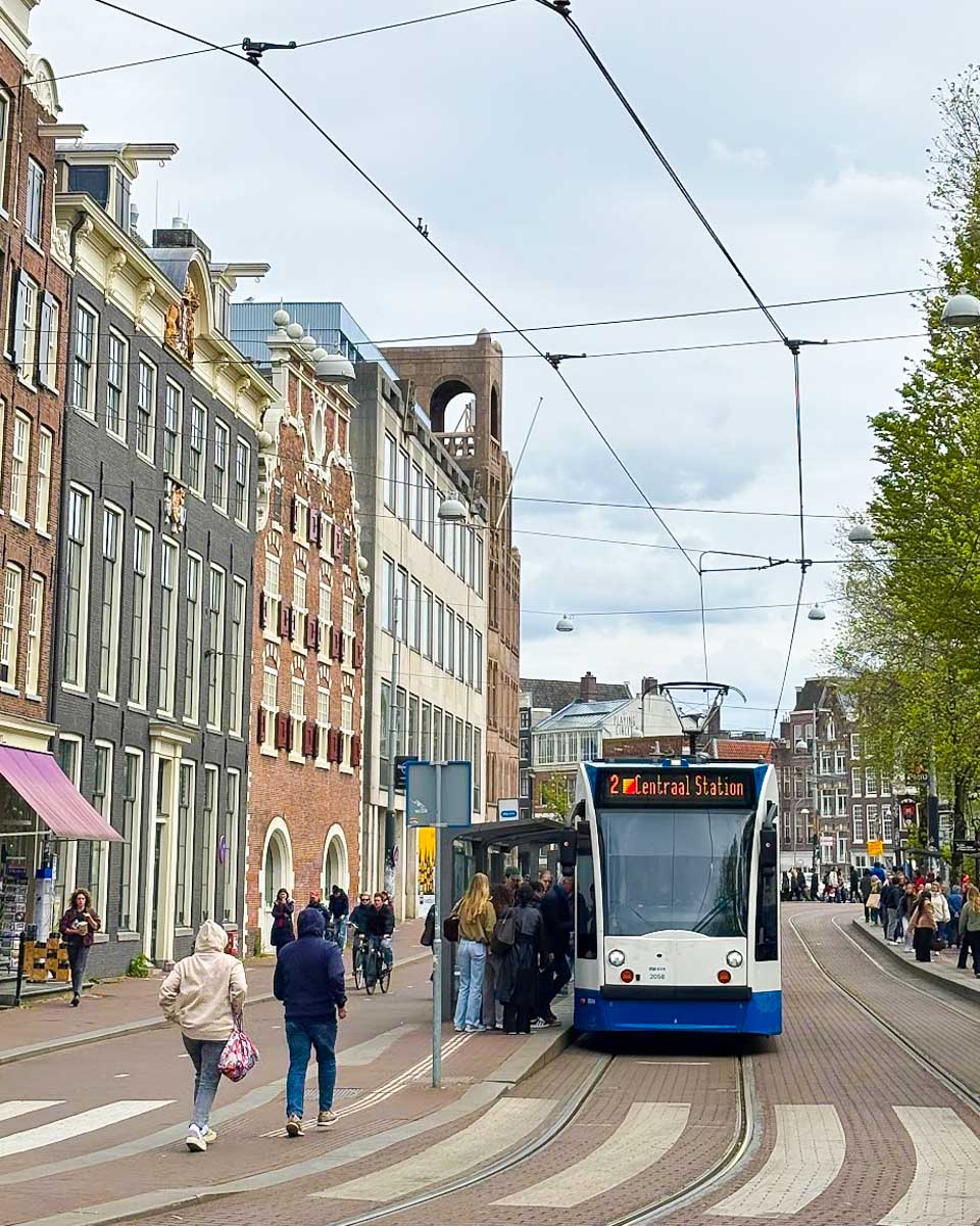 Amsterdams transit train stopping to pick people up