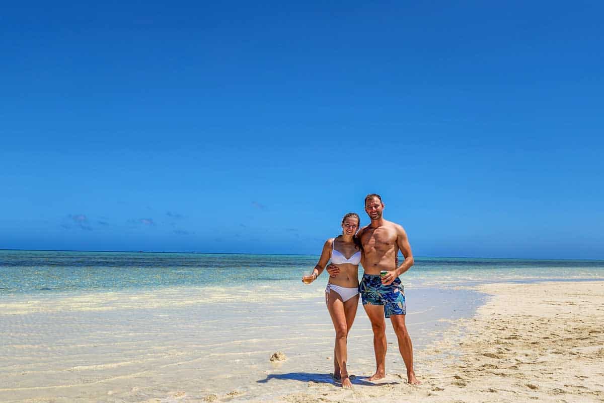 Bailey-and-Daniel-pose-for-a-photo-on-the-beach-in-Moorea