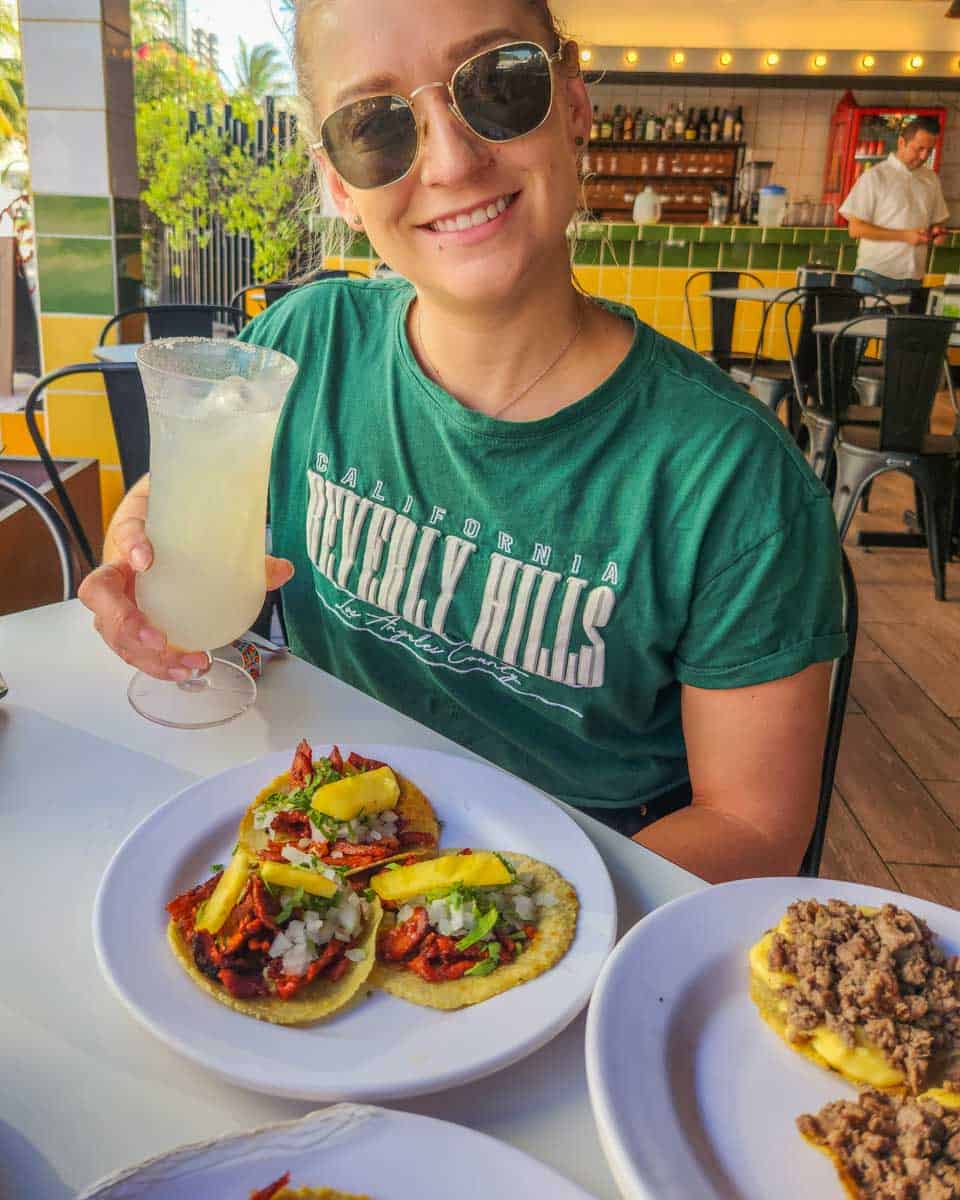 Bailey-with-her-tacos-and-margarita-in San Antonio Texas