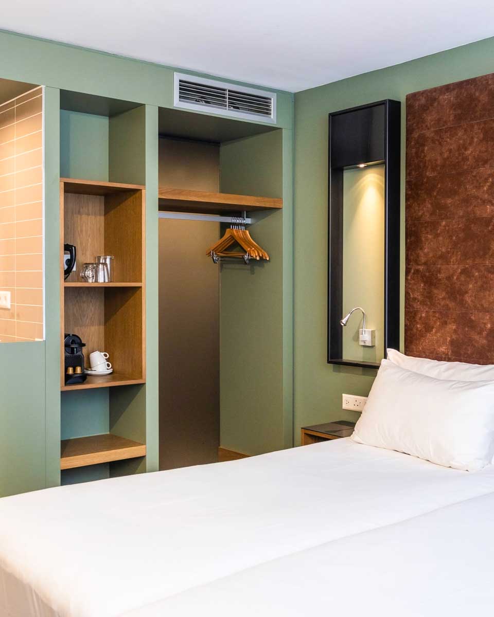 Bed in a hotel room at Hotel De Hallen in Amsterdam