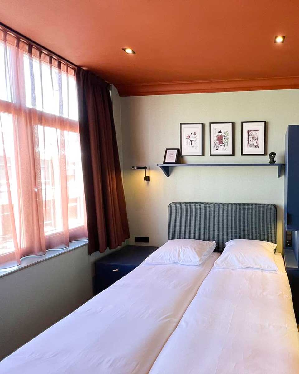 Bed in hotel room of Hotel Nicolaas Witsen in Amsterdam