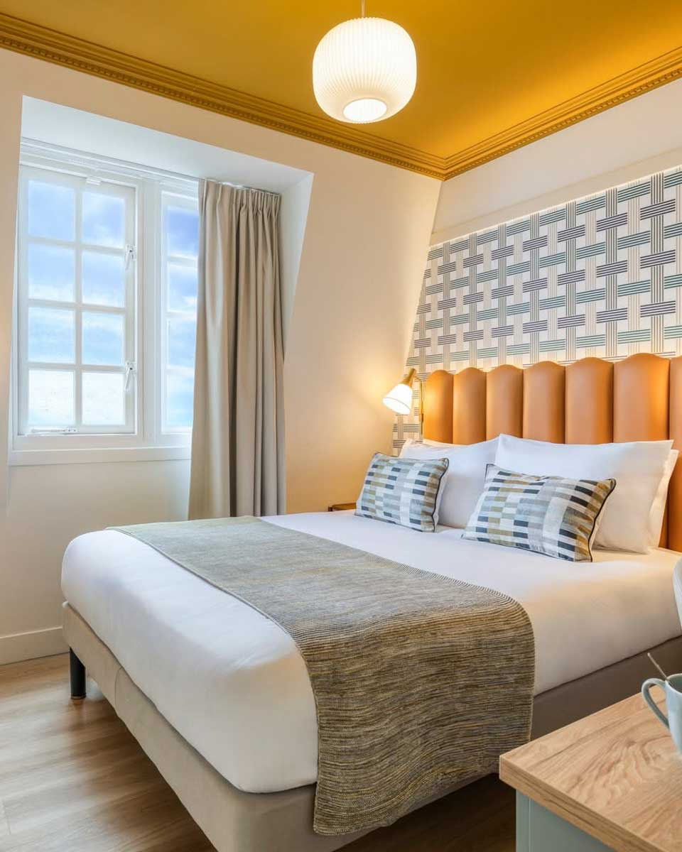 Bed in the hotel room at Citadines Canal Amsterdam