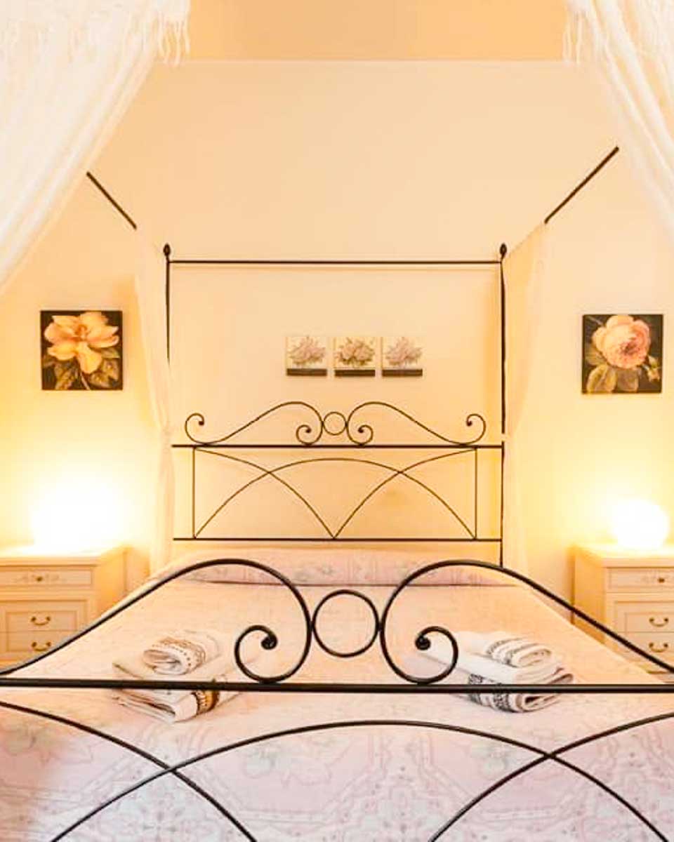Bed in the hotel room at La Castellana Loft Hotel in Bergamo