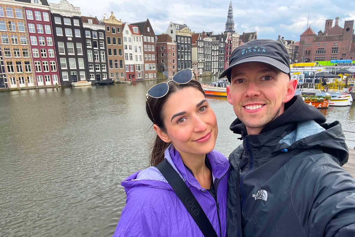Brittni and Jesse take a selfie in front of the canal in Amsterdam