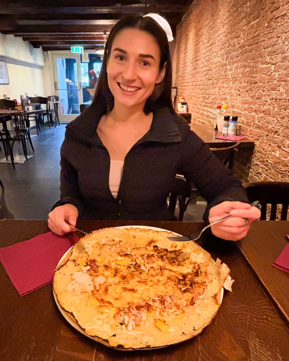 Brittni eats a traditional dutch pancake in Amsterdam
