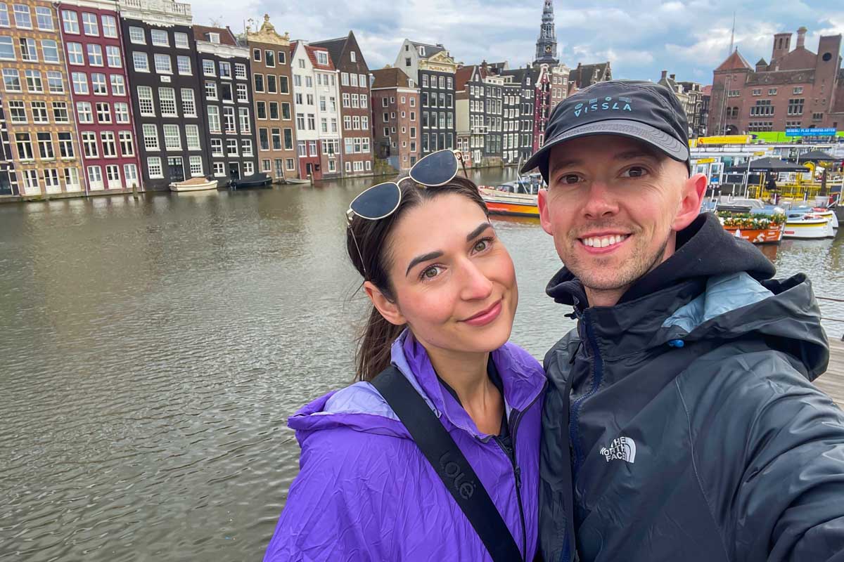 Brittni and Jesse take a selfie in front of the canal in Amsterdam