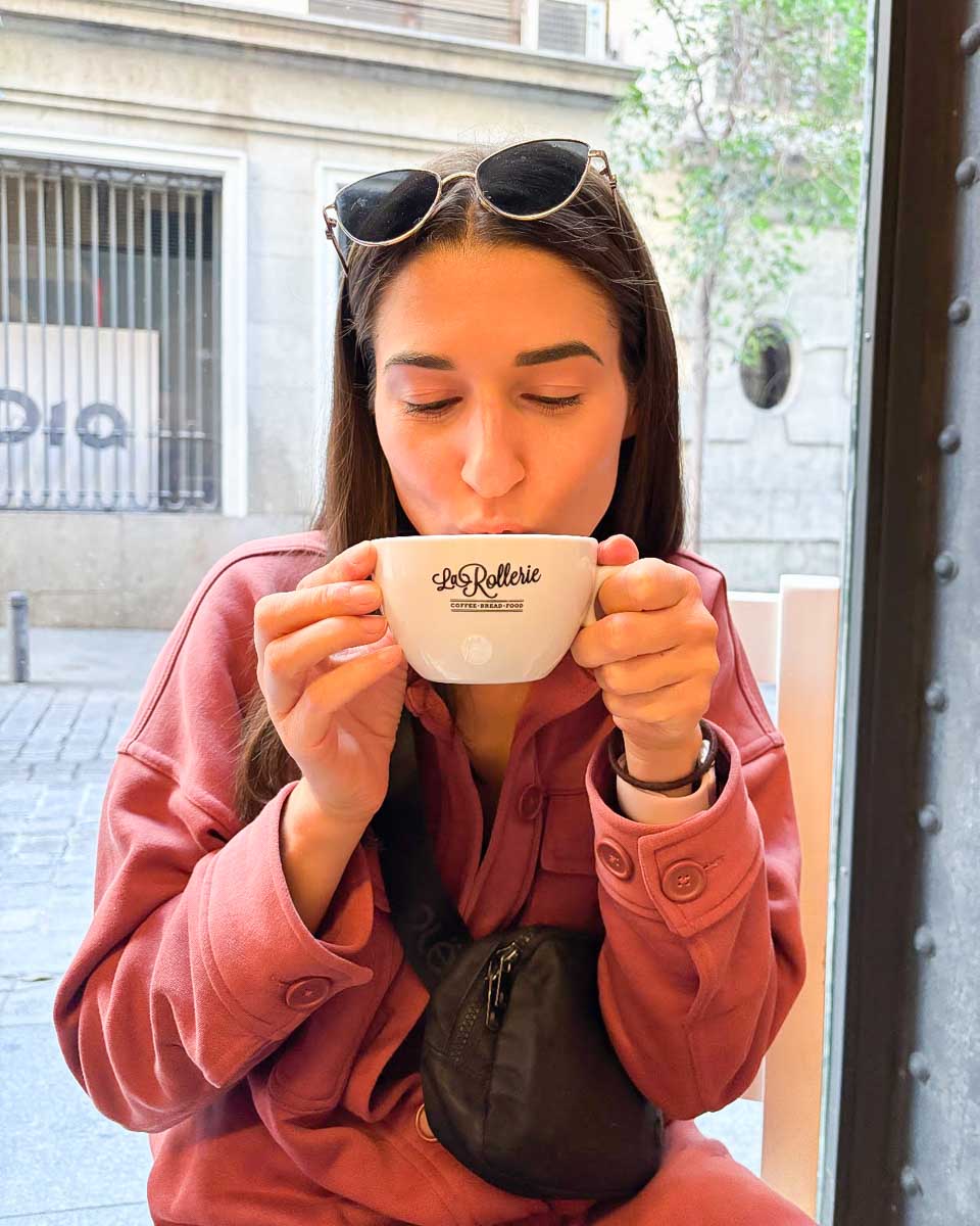 Brittni-sips-her-coffee-at-La-Rollerie-in-Madrid-Spain