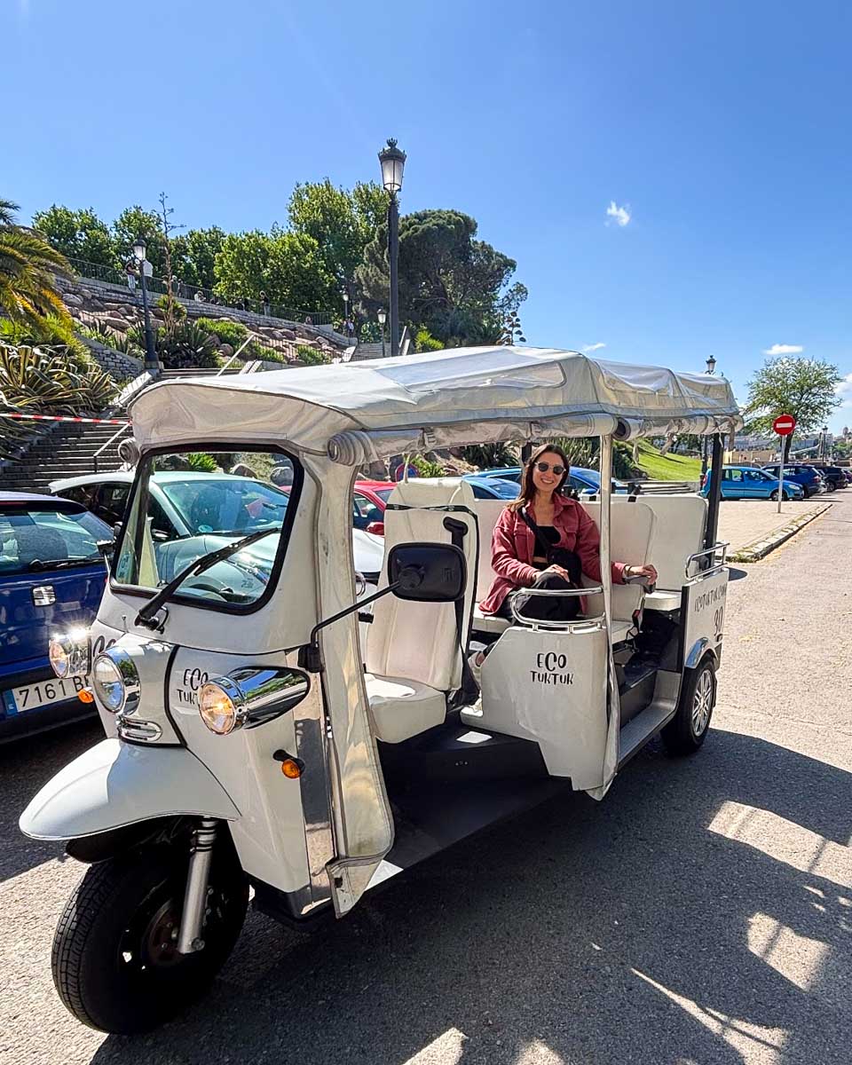 Brittni sits in the tuk tuk on a tour in Madrid