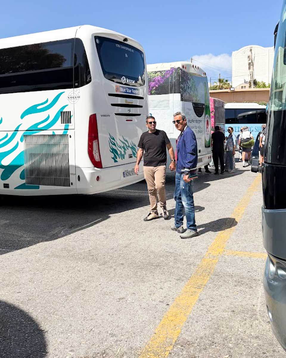 Public buses parked at the Fira bus station in Santorini