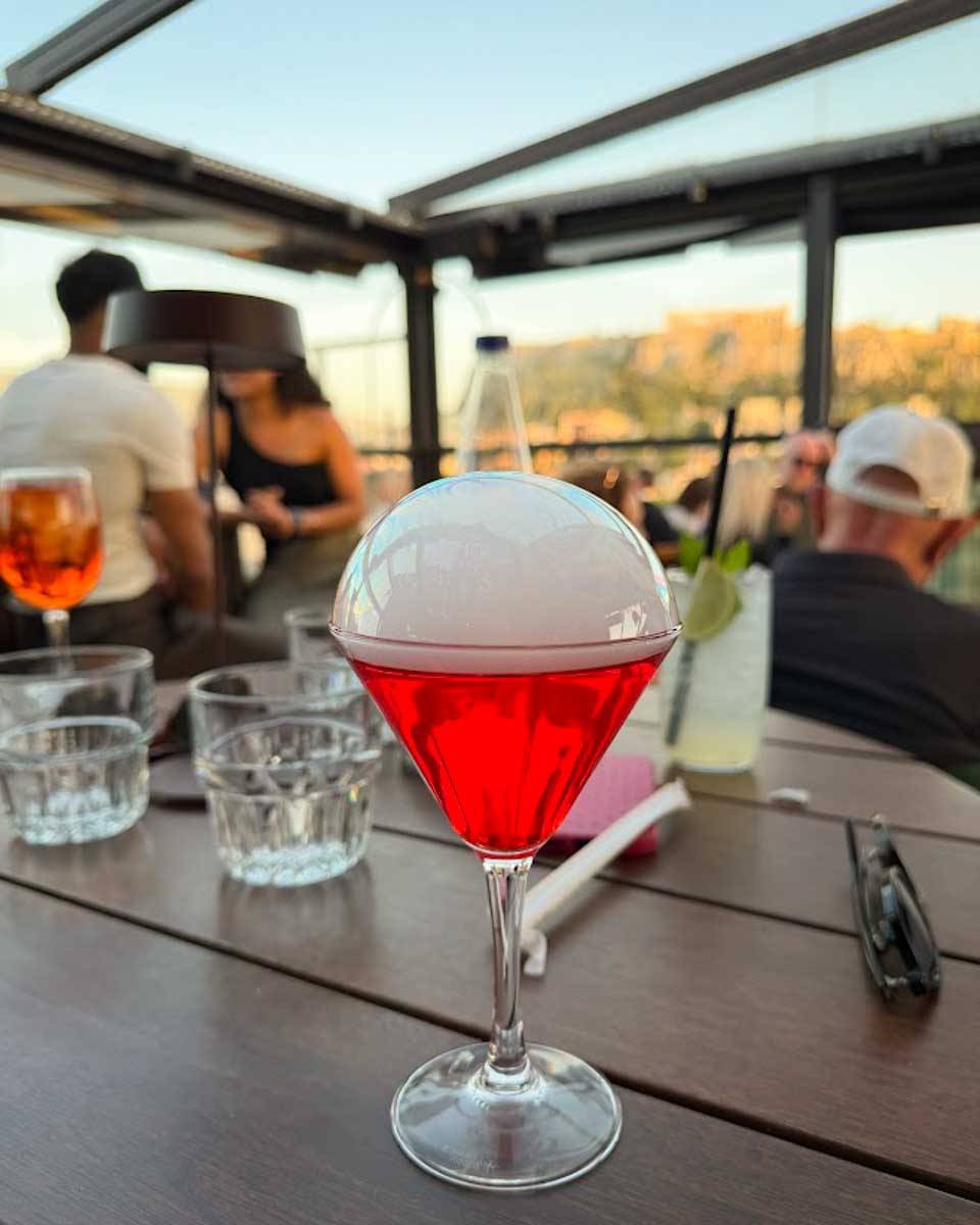 Creado red drink at Attic Urban Rooftop in Athens Greece on Hannah trip