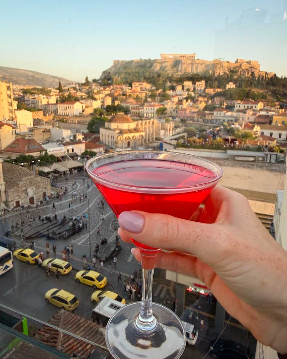 Creado red drink with a view of Acropolis at Attic Urban Rooftop in Athens Greece on Hannah trip