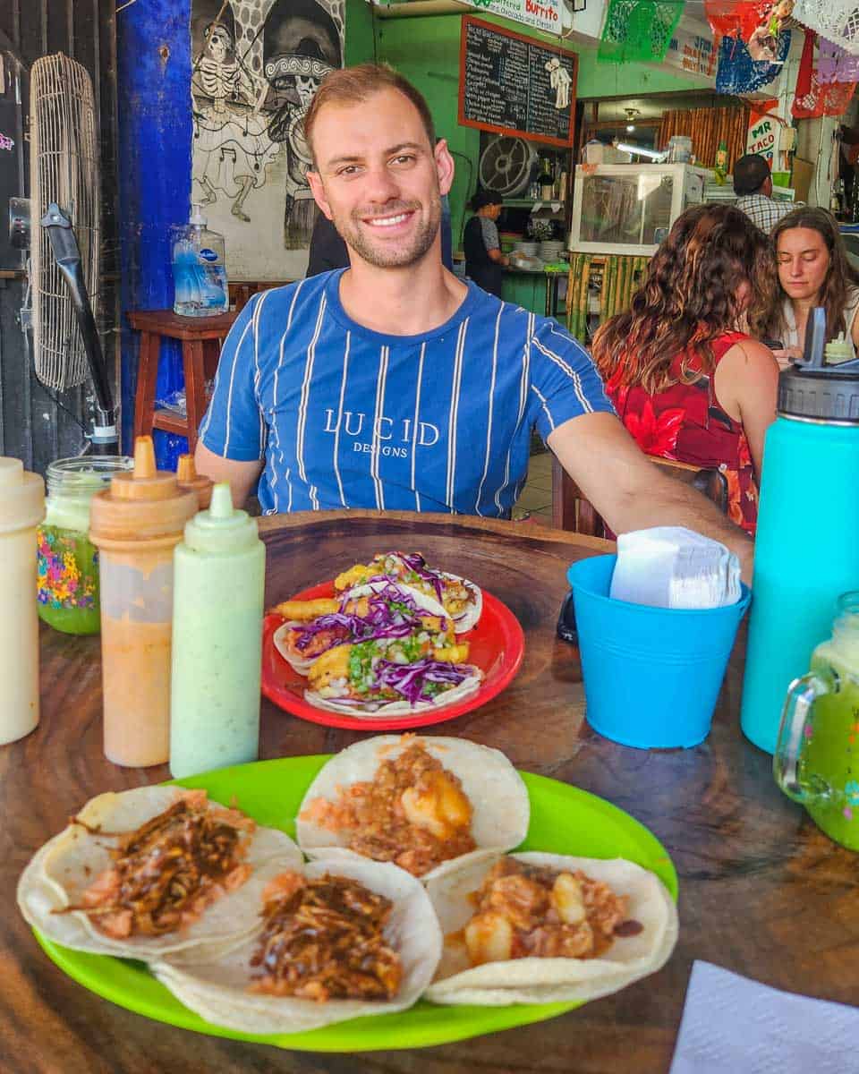 Daniel-with-a-plate-of-tacos-in-San Antonio Texas