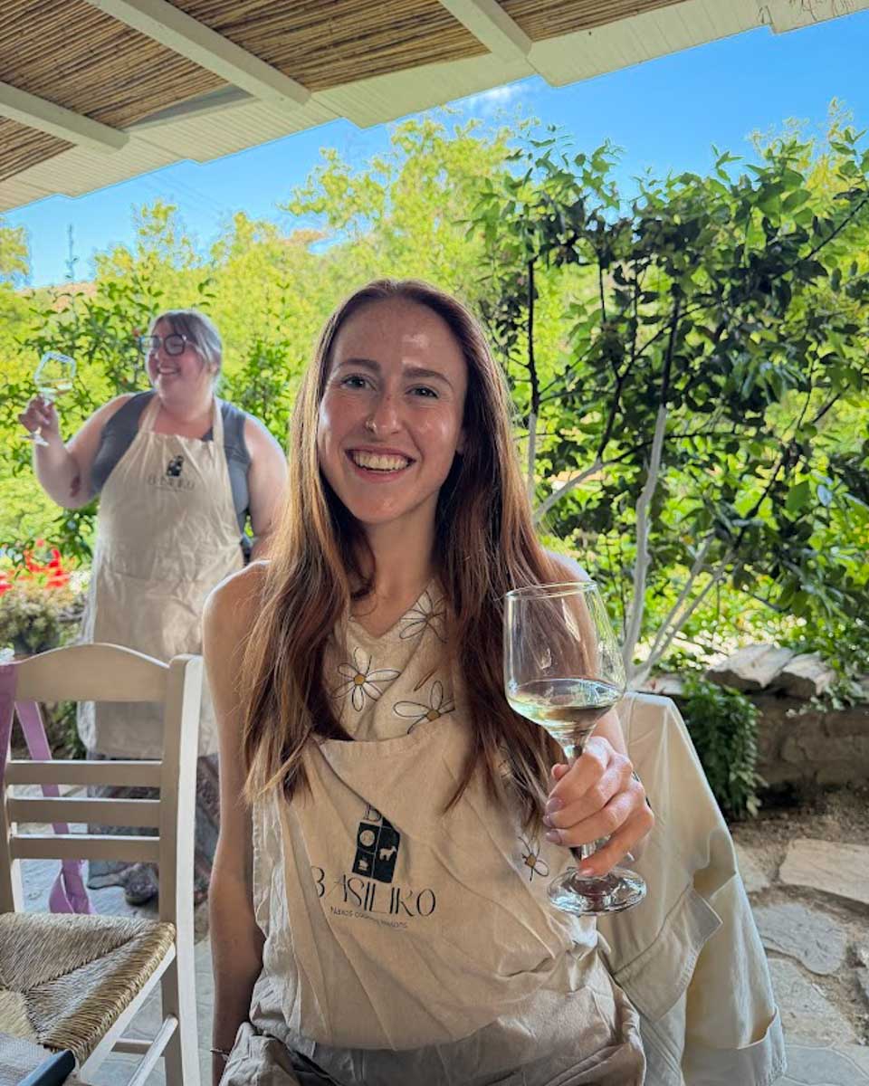 Hannah drinking wine in cooking class in Naxos Greece