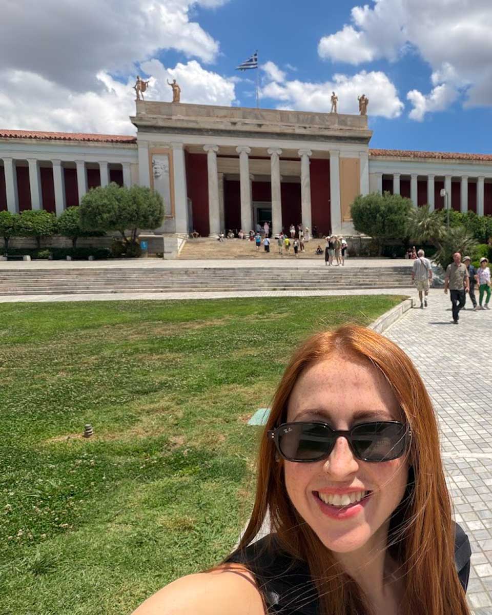 Hannah in front of the National Archaeological Museum in Athens Greece