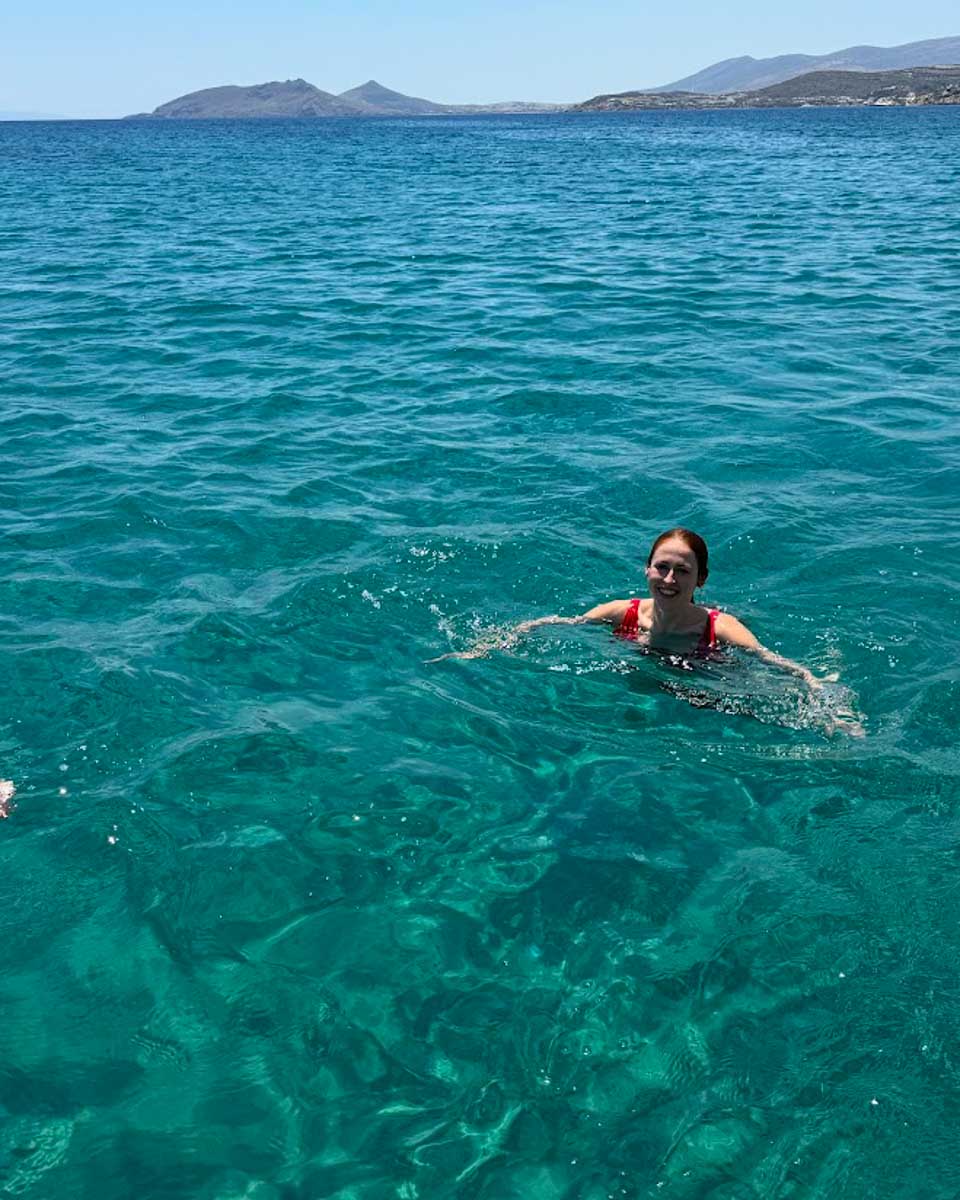 Hannah swimming on a catamaran cruise in Naxos Greece