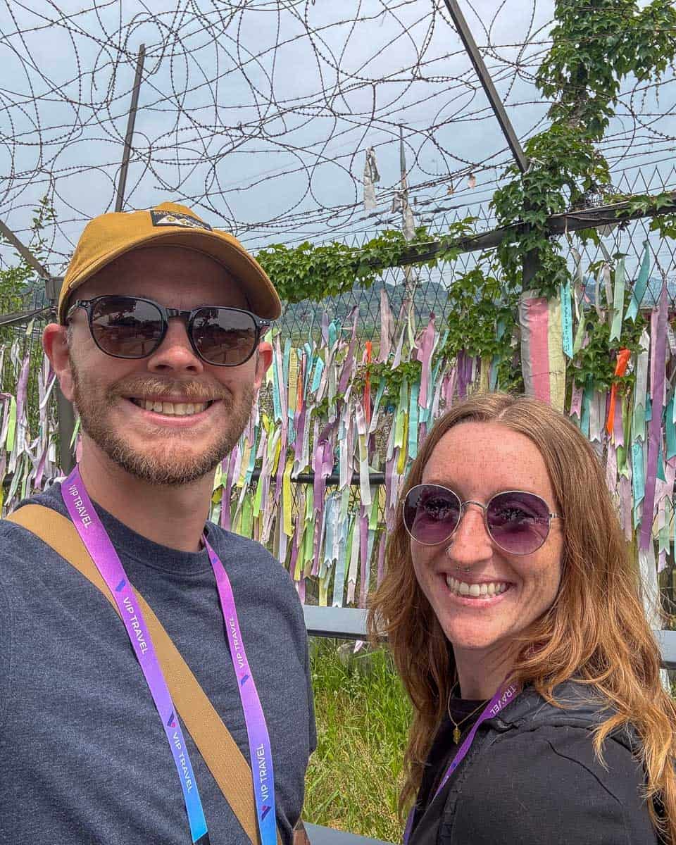 Meghan and Evan at the DMZ fence on a tour from Seoul, South Korea