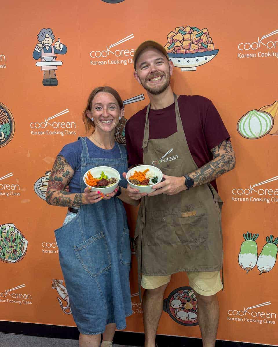 Meghan and Evan hold bibimbap they made during a cooking class in Seoul South Korea (2)