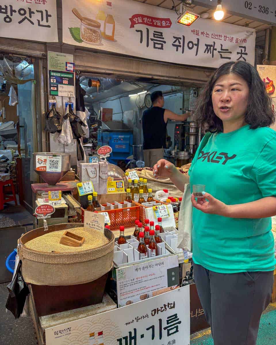 Our guide showing us local ingredients at Mangwon Market during a cooking class in Seoul South Korea