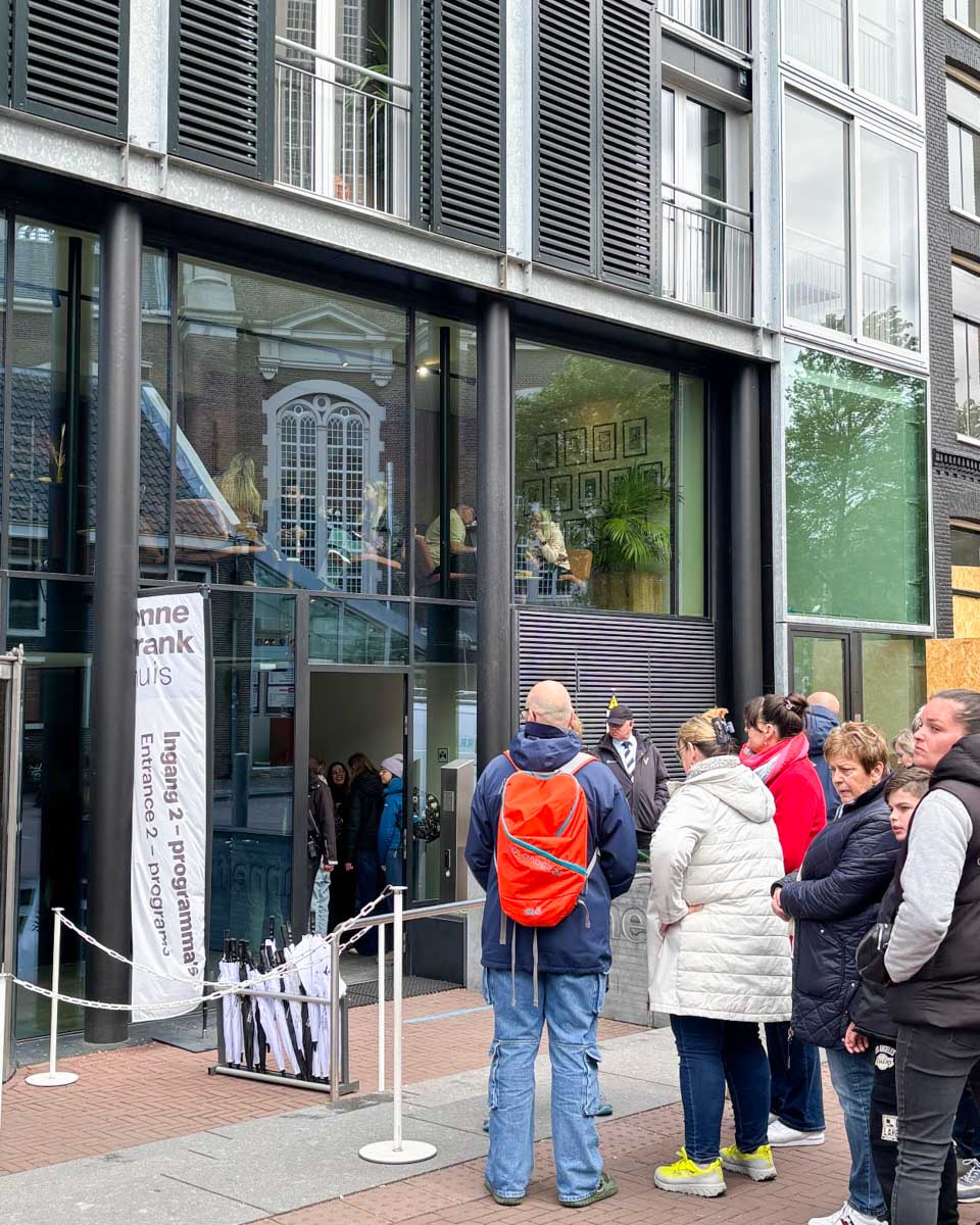 People line up outside the entrance to the Anne Frank Museum in Amsterdam