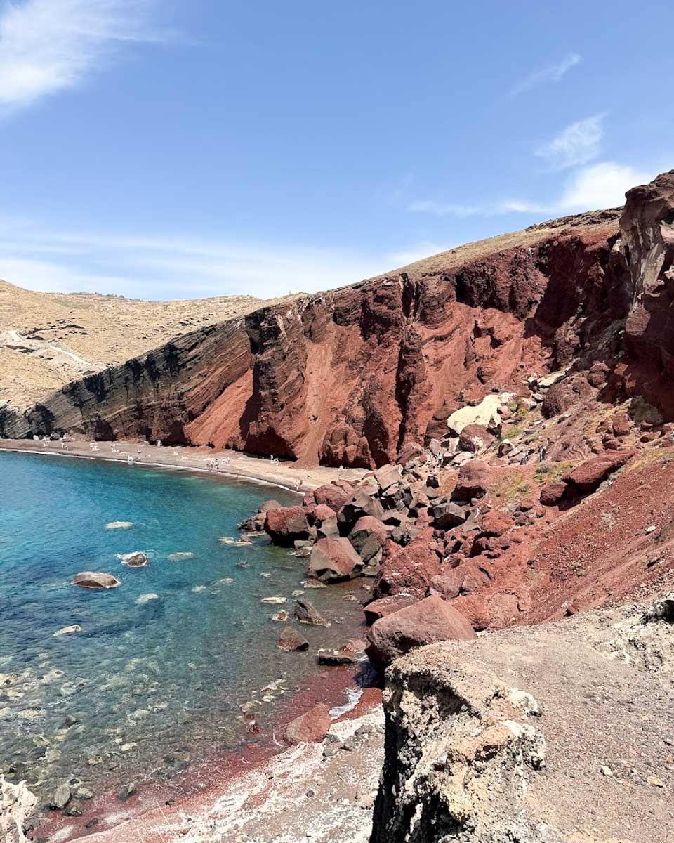 View of the red volcanic cliffs at Red Beach in Santorini