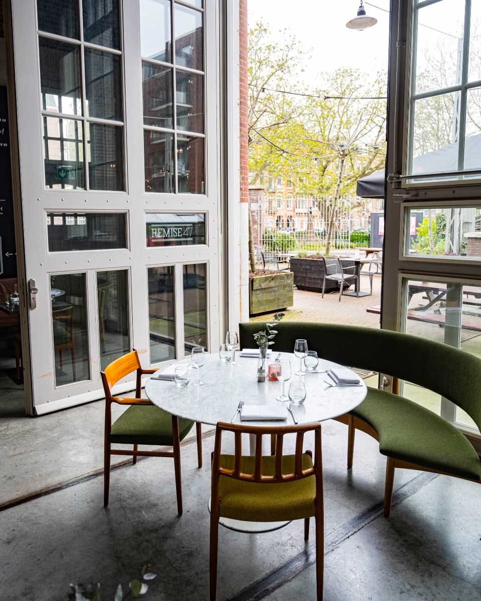 Restaurant patio area at Hotel De Hallen in Amsterdam