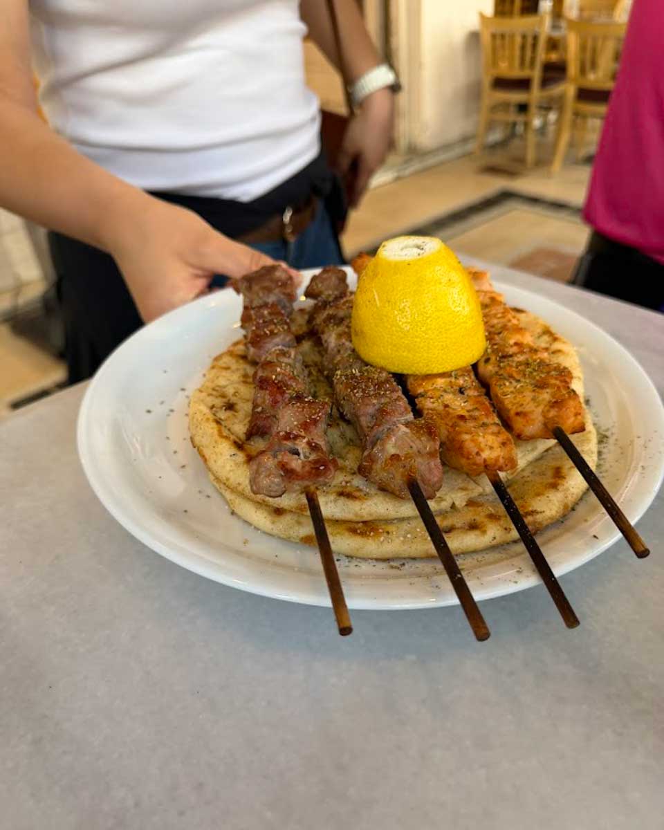 Souvlaki skewers on food tour in Athens Greece on Hannah trip