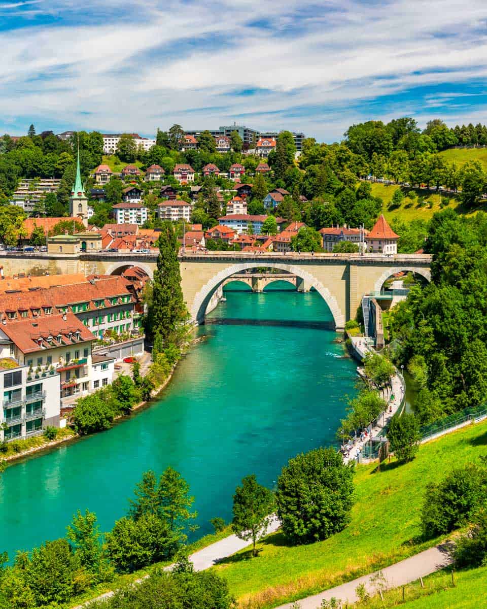 View of the Bern old city center and Nydeggbrucke bridge over Aare River in Bern, Switzerland